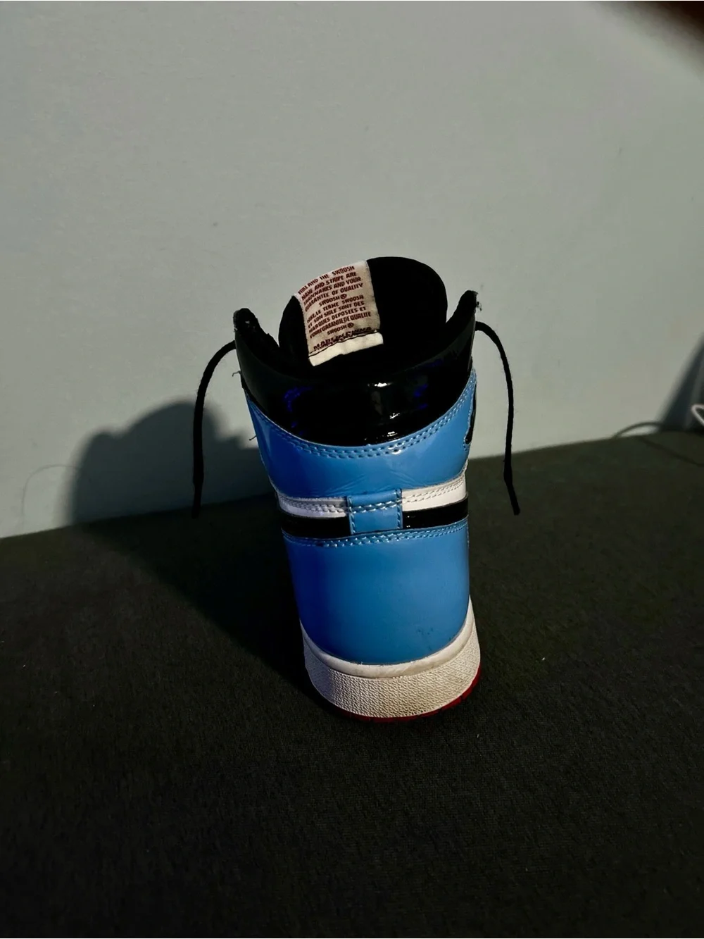 Nike Jordan 1 High-Top Sneaker in Red White Blue with Black Swoosh